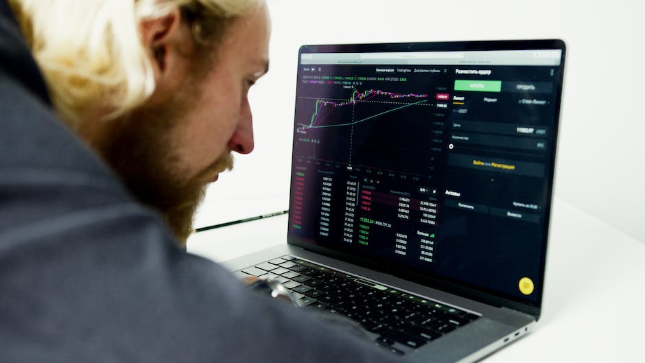 A person analyzing data on a computer screen.